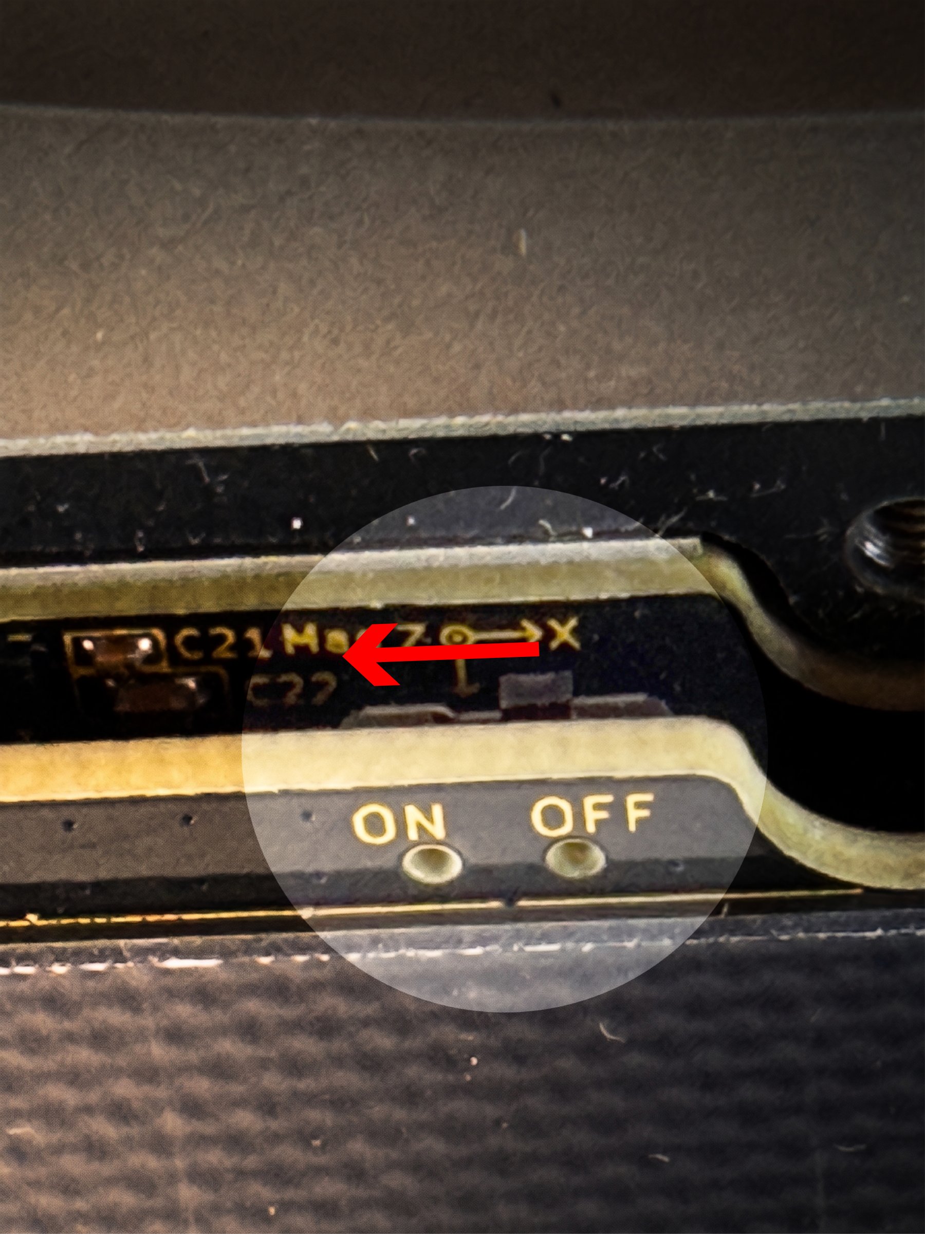 Close-up of the side power switch on the front PCBA with the silkscreen ON / OFF label